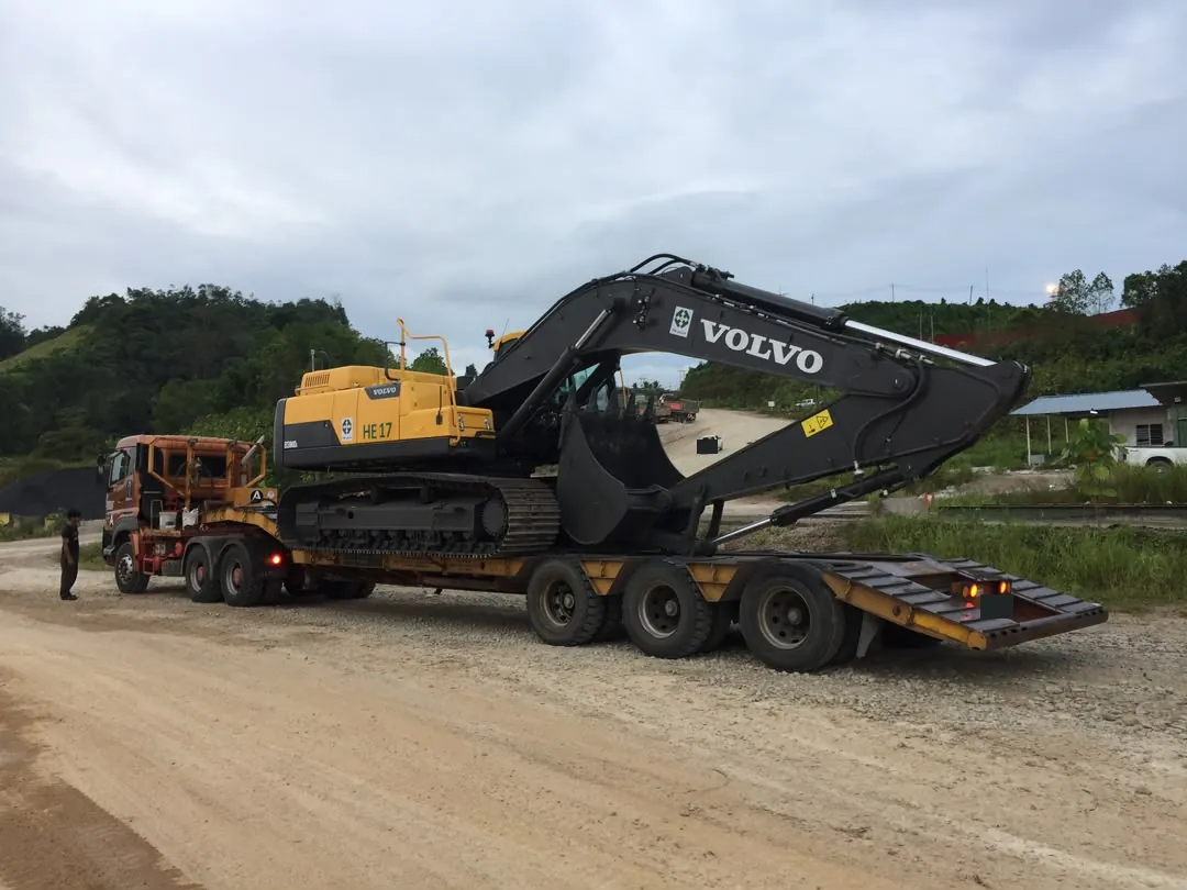 Volvo excavator carried on a low bed trailer